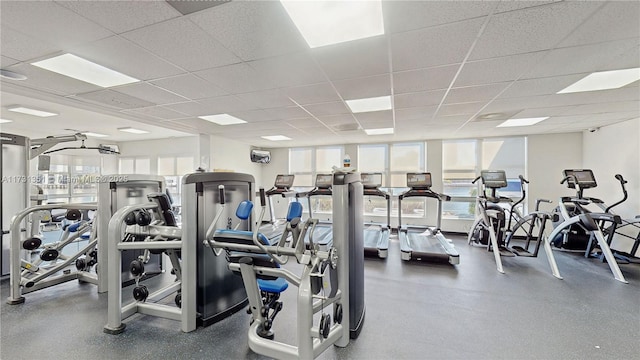 exercise room featuring a drop ceiling