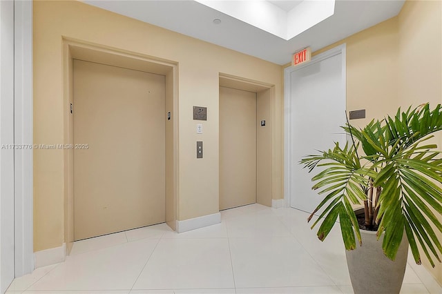 entrance to property with a patio and elevator