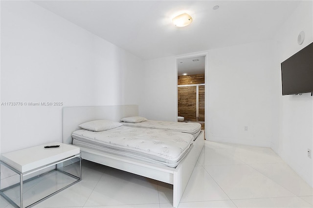 bedroom featuring light tile patterned flooring