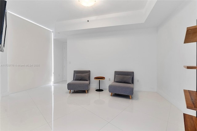 sitting room with light tile patterned floors