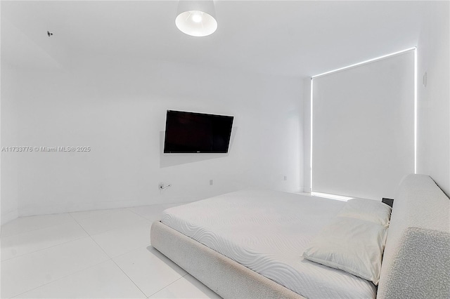 bedroom with light tile patterned flooring