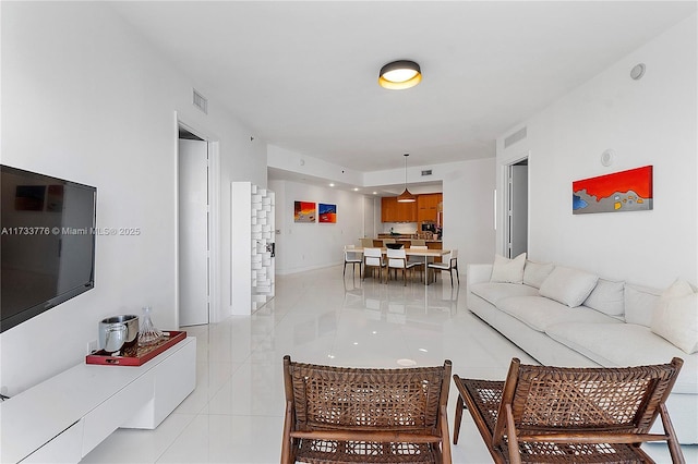 living room featuring light tile patterned floors