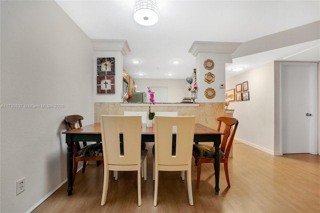 dining space featuring light hardwood / wood-style floors