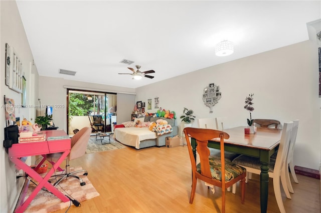 bedroom with hardwood / wood-style flooring, access to exterior, and ceiling fan