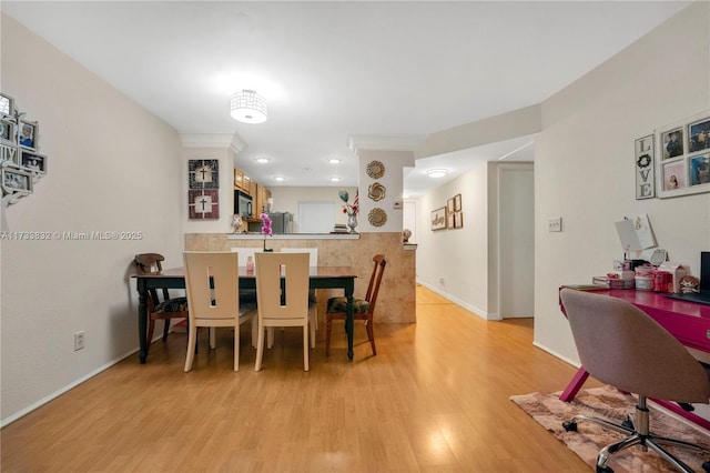 dining area with light hardwood / wood-style flooring