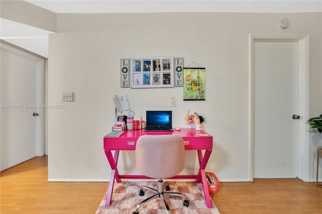 office with wood-type flooring