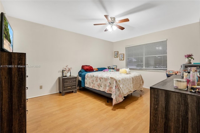 bedroom with hardwood / wood-style flooring and ceiling fan