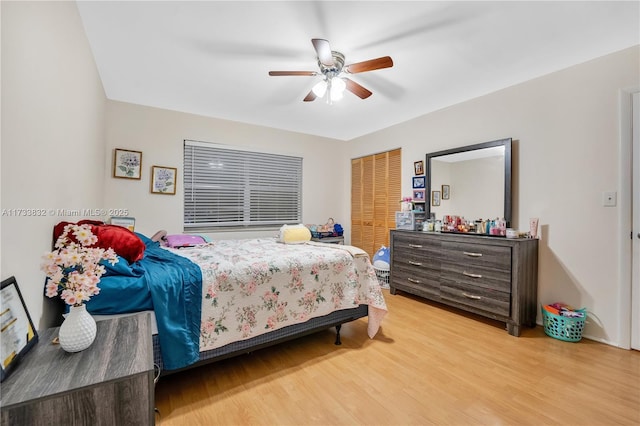 bedroom featuring ceiling fan, wood-type flooring, and a closet