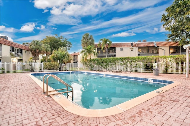 view of swimming pool with a patio area