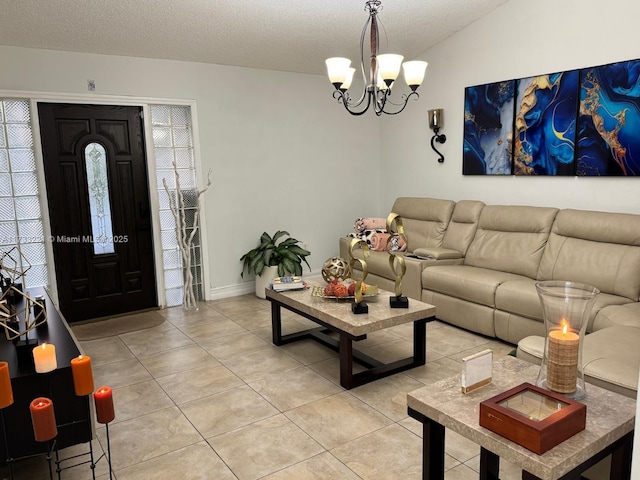 tiled living room featuring an inviting chandelier and a textured ceiling