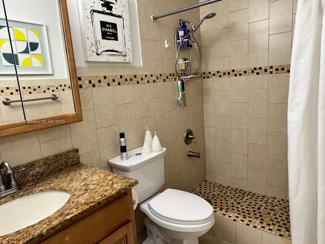 bathroom featuring vanity, tile walls, toilet, and walk in shower