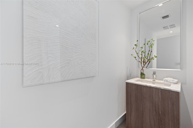 bathroom featuring vanity and visible vents