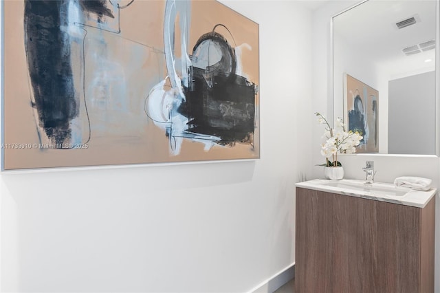 bathroom with visible vents and vanity