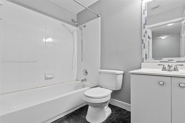 full bathroom featuring tiled shower / bath, vanity, toilet, and a textured ceiling