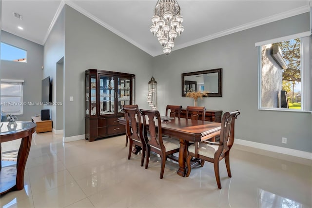 dining room featuring crown molding, lofted ceiling, light tile patterned floors, and an inviting chandelier