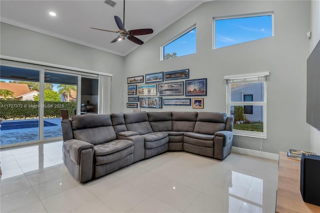 tiled living room with crown molding, high vaulted ceiling, and ceiling fan