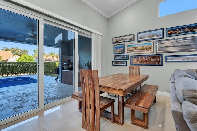 dining area with ornamental molding, plenty of natural light, and light tile patterned floors