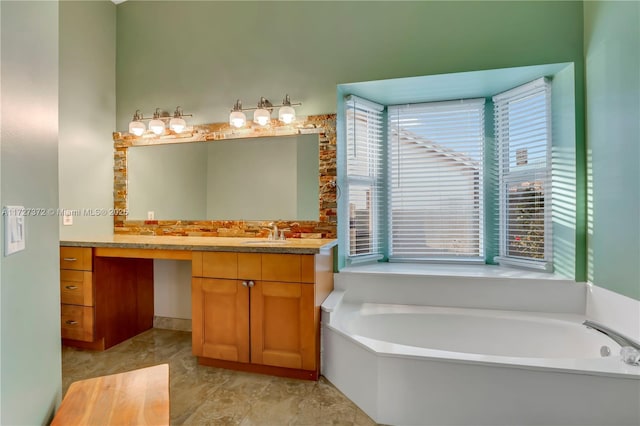 bathroom with vanity and a bath