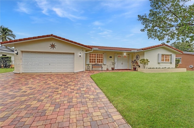 view of front facade with a garage and a front yard