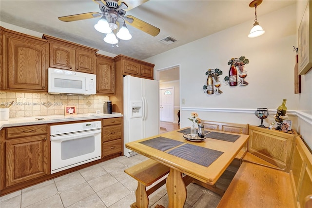 kitchen with white appliances, ceiling fan, hanging light fixtures, backsplash, and light tile patterned flooring