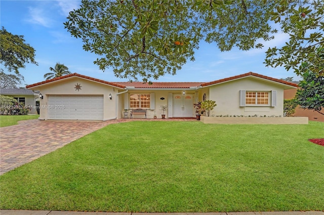 view of front of home featuring a garage and a front yard