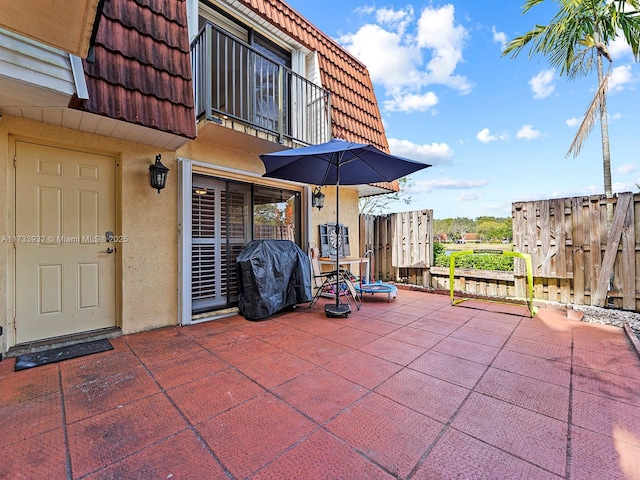 view of patio featuring a grill