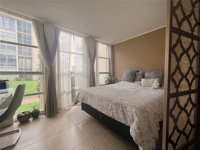 tiled bedroom featuring a textured ceiling