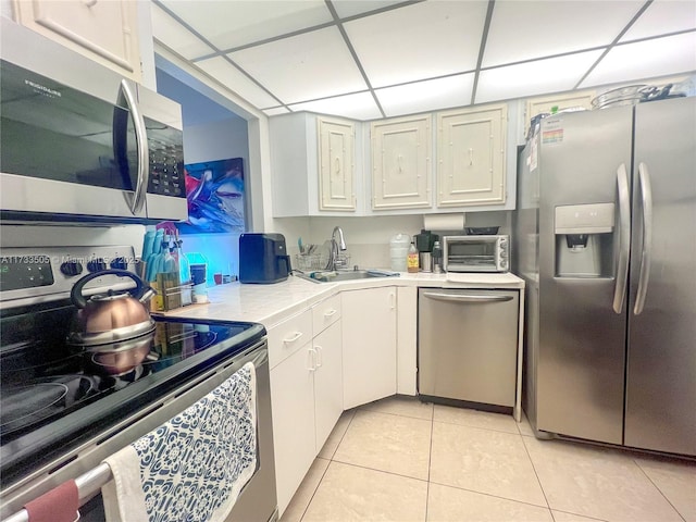 kitchen with white cabinetry, appliances with stainless steel finishes, and sink