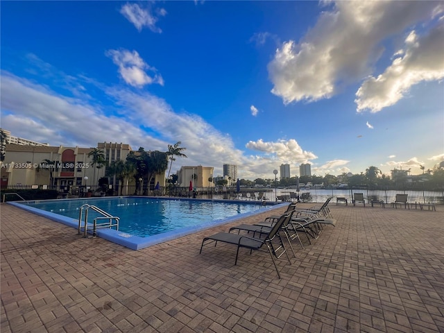 view of swimming pool with a patio