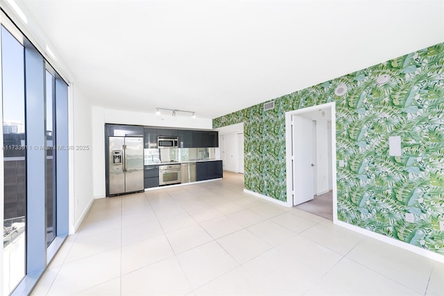 unfurnished living room featuring light tile patterned floors