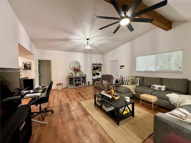 living room with vaulted ceiling with beams, hardwood / wood-style floors, and ceiling fan