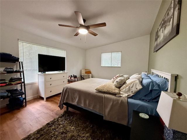 bedroom with light wood-type flooring and ceiling fan