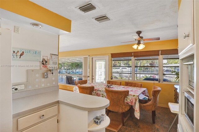 bathroom with vanity, tile walls, tile patterned floors, and a shower with shower door