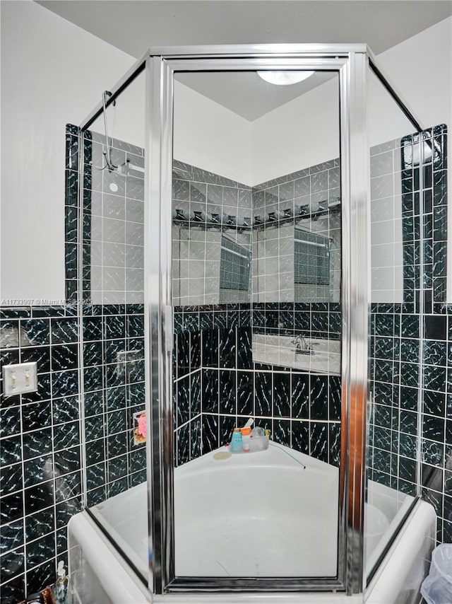 bathroom with tile walls