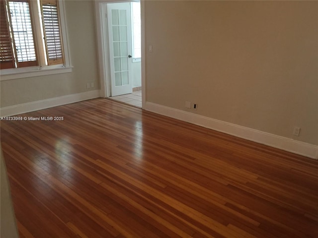 empty room with light hardwood / wood-style flooring