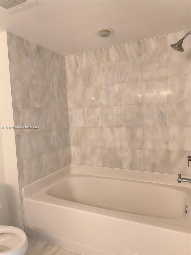 bathroom featuring shower / tub combination