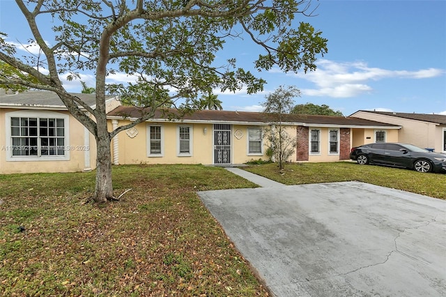 ranch-style house with a front lawn