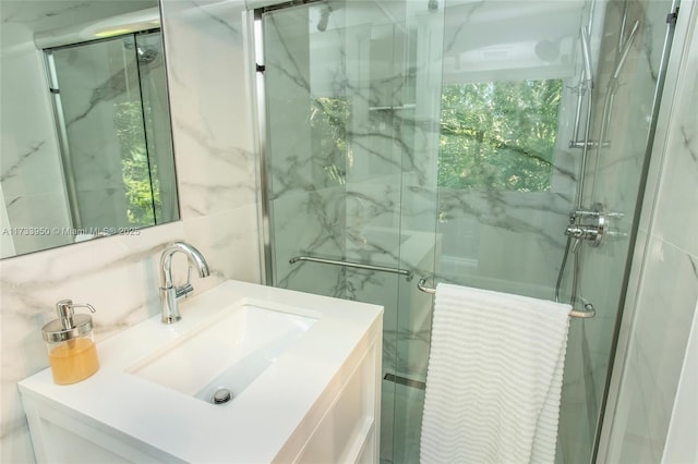 bathroom featuring vanity, tile walls, decorative backsplash, and a shower with shower door