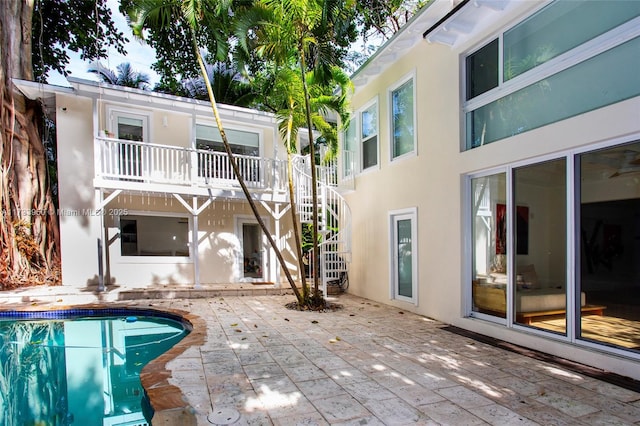 back of property with a patio area