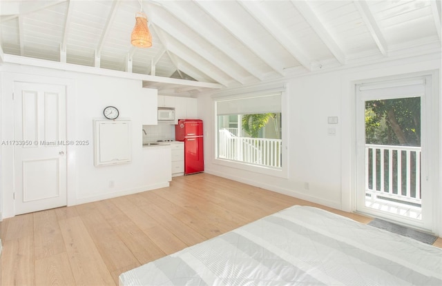 bedroom with sink, access to exterior, hardwood / wood-style floors, and vaulted ceiling with beams