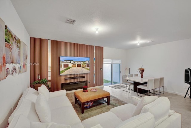 living room featuring light tile patterned flooring