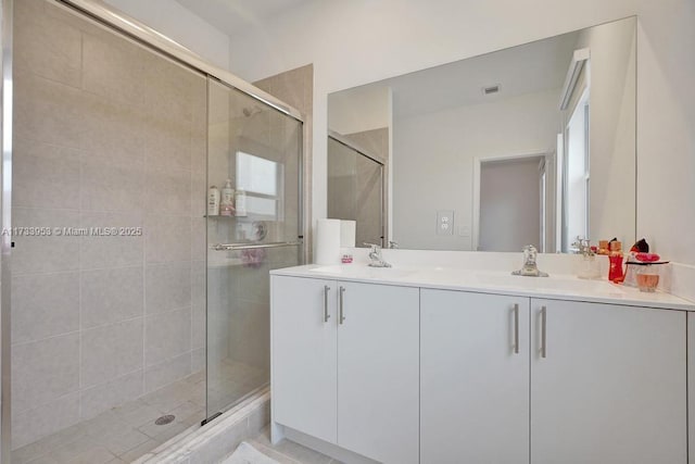 bathroom with vanity and walk in shower