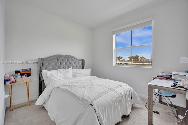 bedroom with light colored carpet