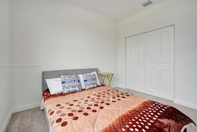 bedroom with a closet and carpet flooring