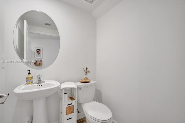 bathroom featuring sink and toilet