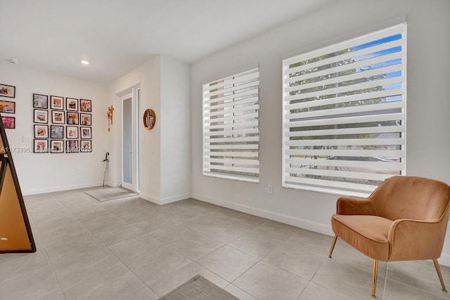 living area featuring light tile patterned floors