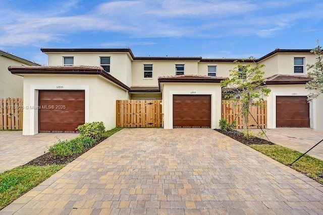 mediterranean / spanish-style home featuring a garage