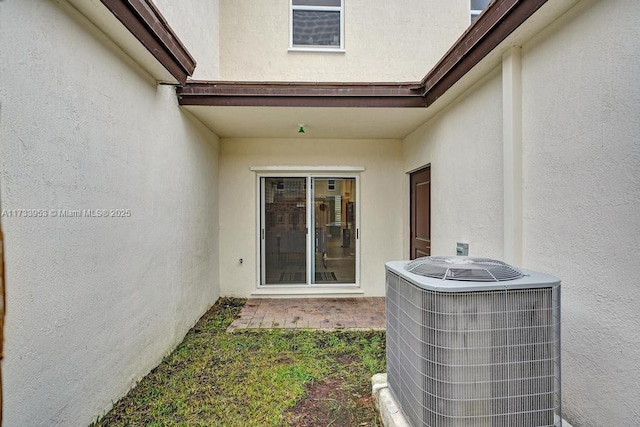 property entrance with central AC unit