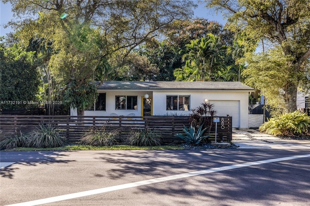 ranch-style house featuring a garage