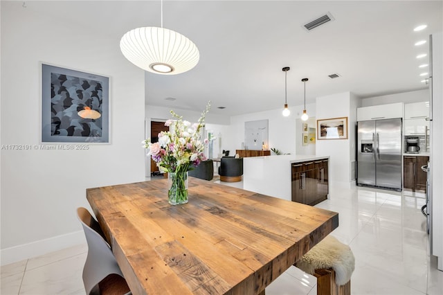 dining space with light tile patterned floors